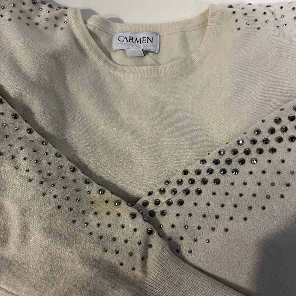 Beautiful NEW sweater with studded sleeves.